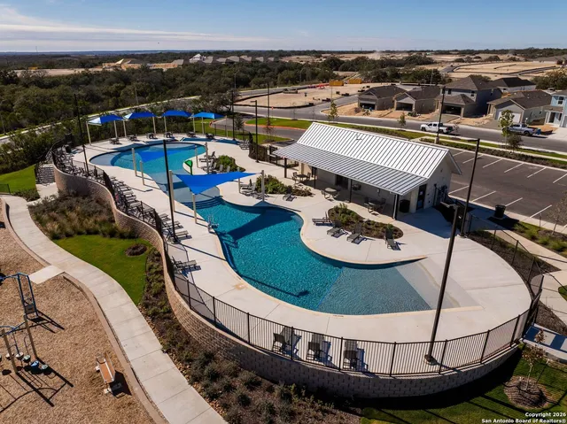 a view of a swimming pool with a patio