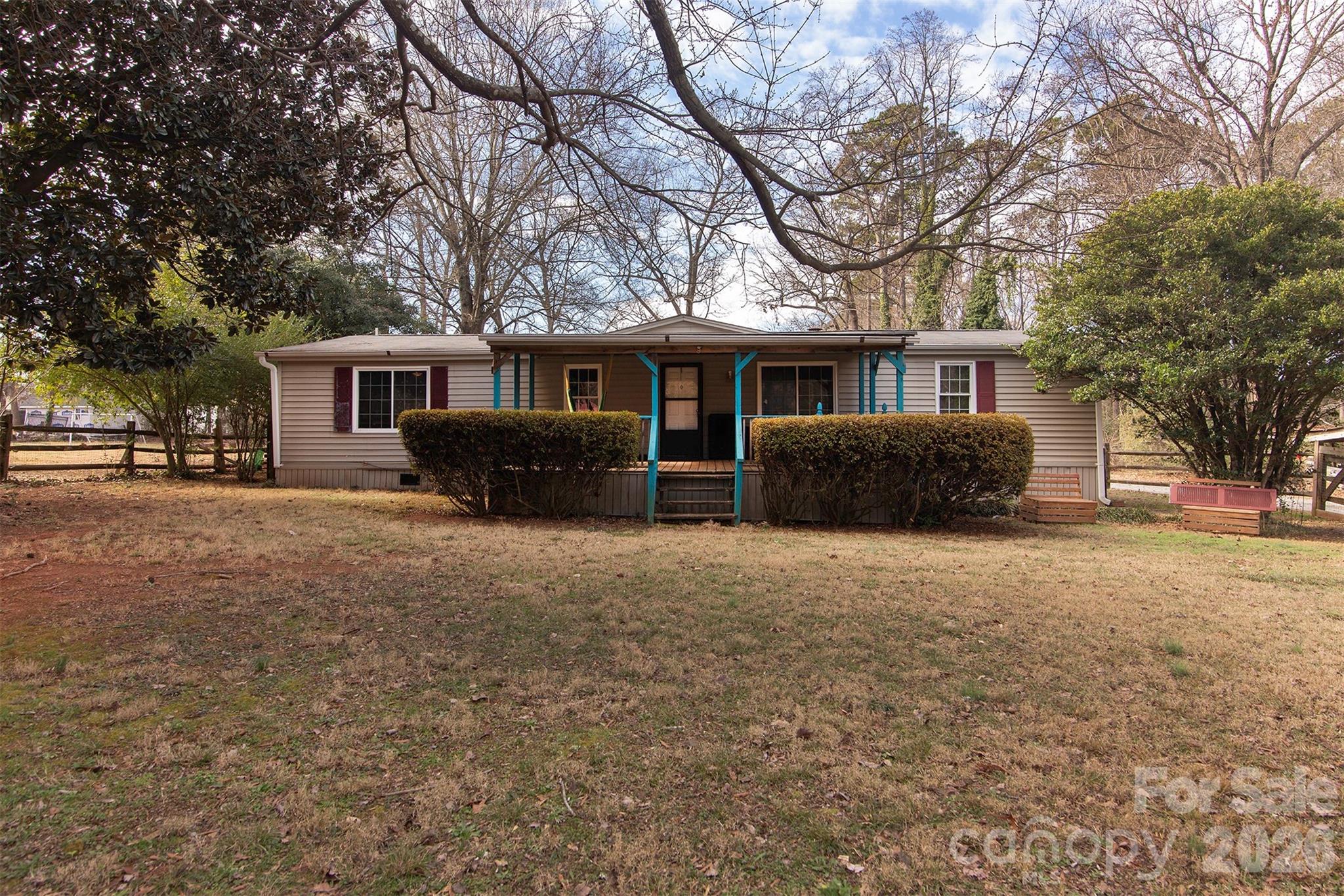 5727 Thompson Road Charlotte, NC 28216 - Photo 1 of 21 a front view of house with yard and trees around