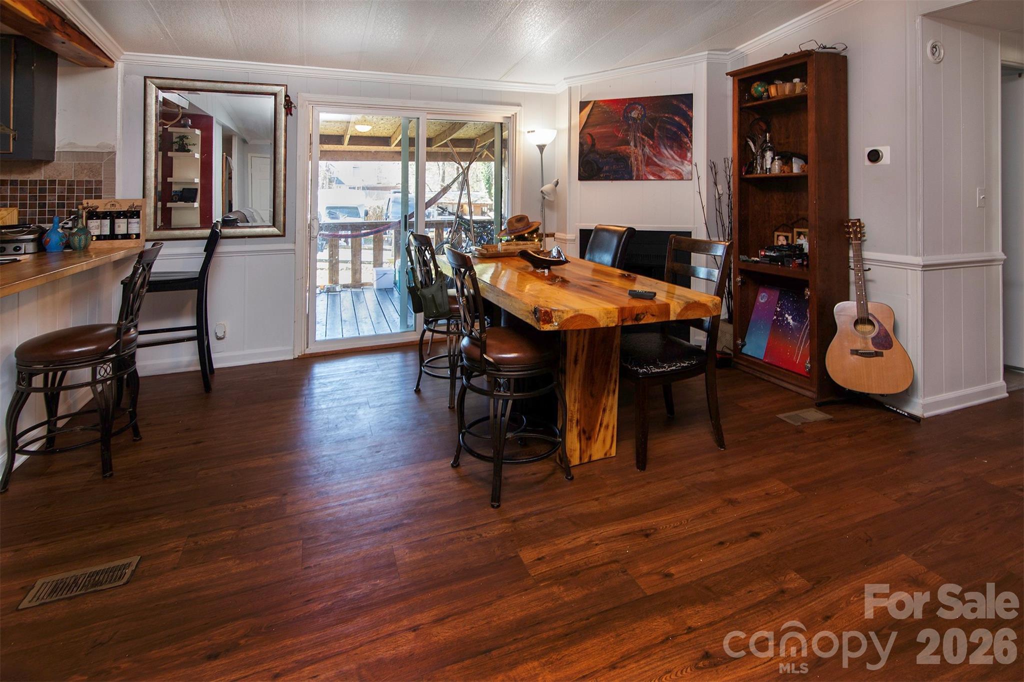 5727 Thompson Road Charlotte, NC 28216 - Photo 11 of 21 a dining room with furniture and wooden floor