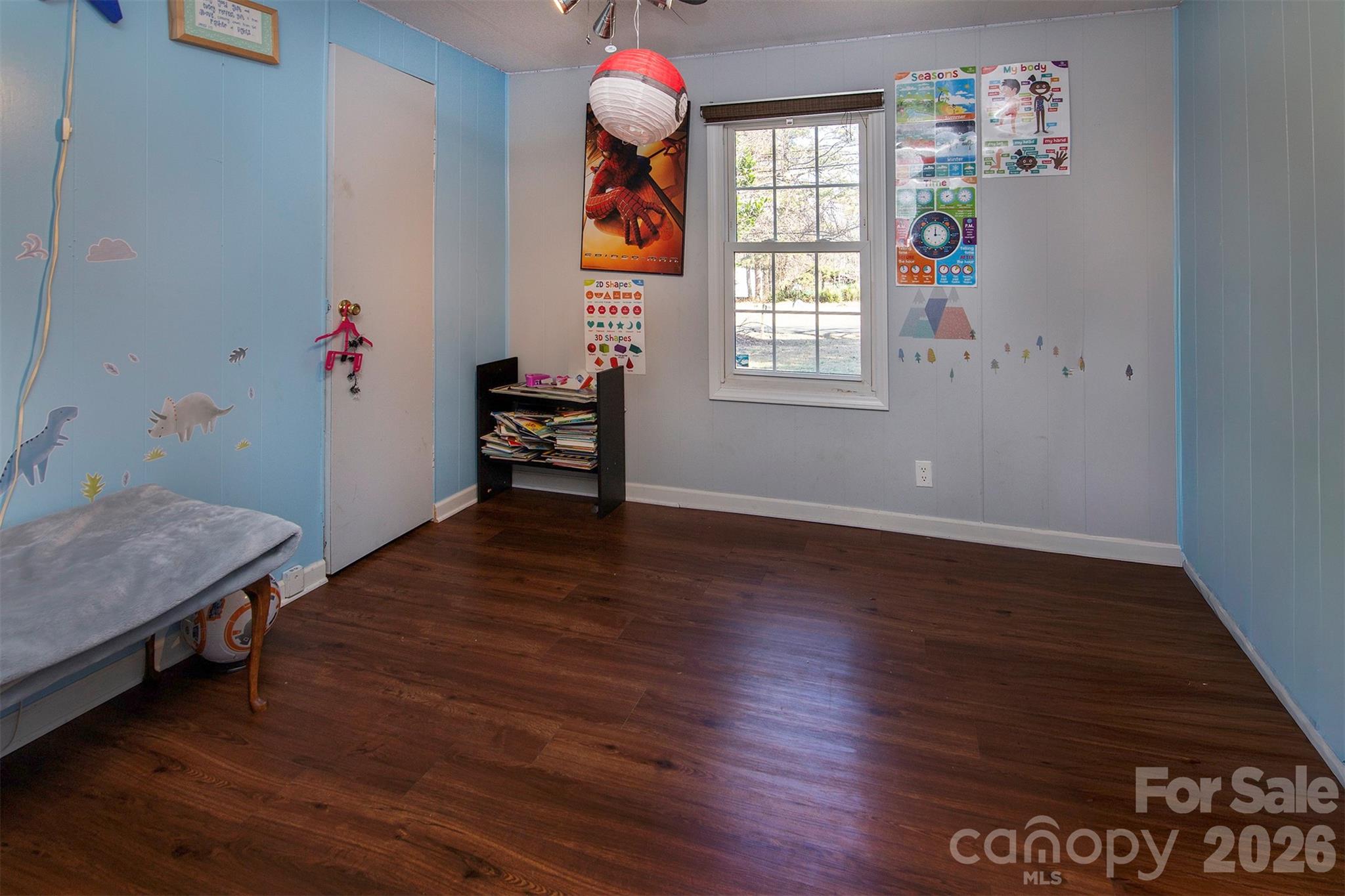 5727 Thompson Road Charlotte, NC 28216 - Photo 17 of 21 a room with wooden floor and window