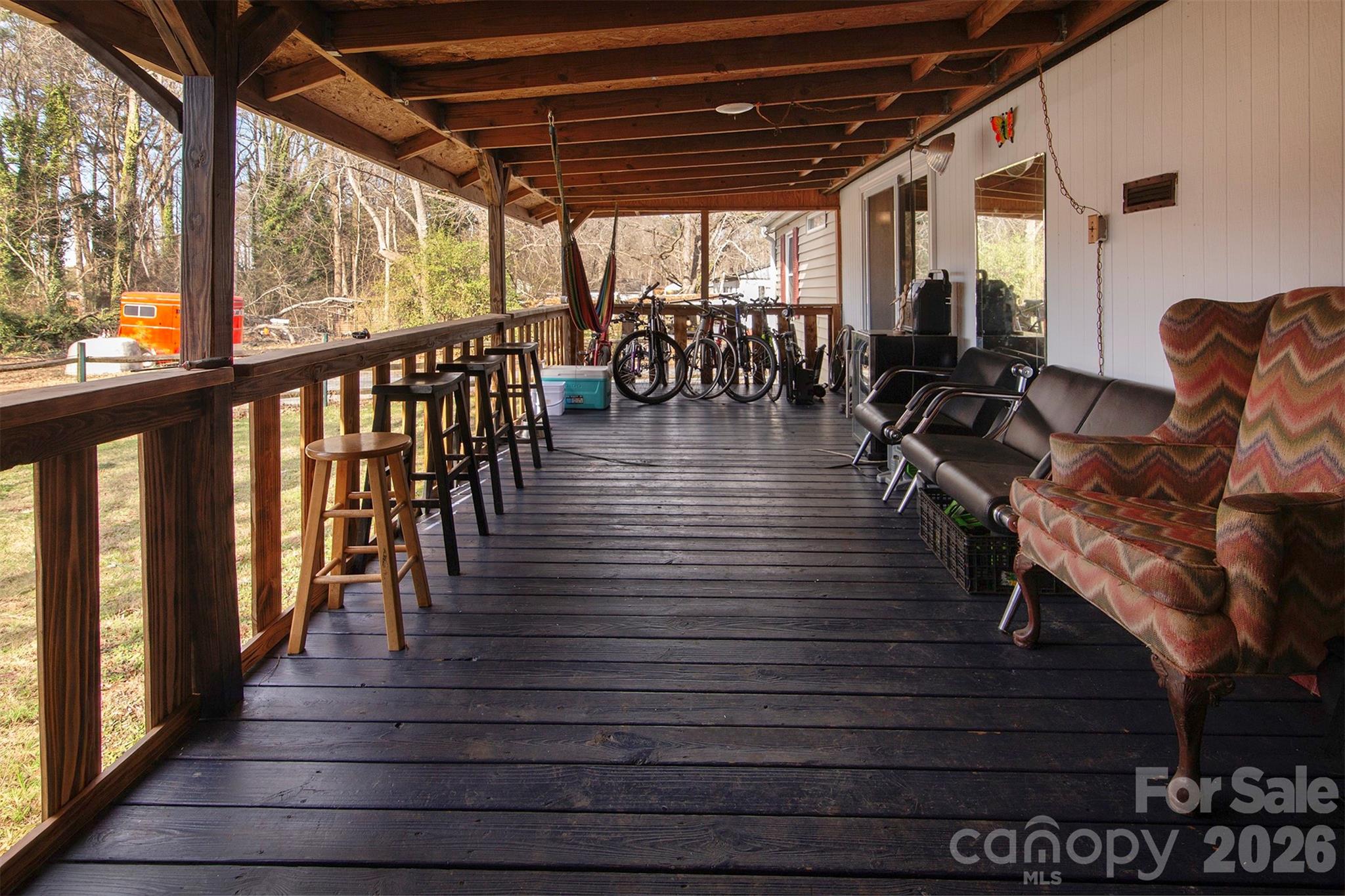 5727 Thompson Road Charlotte, NC 28216 - Photo 18 of 21 a view of a porch with wooden floor