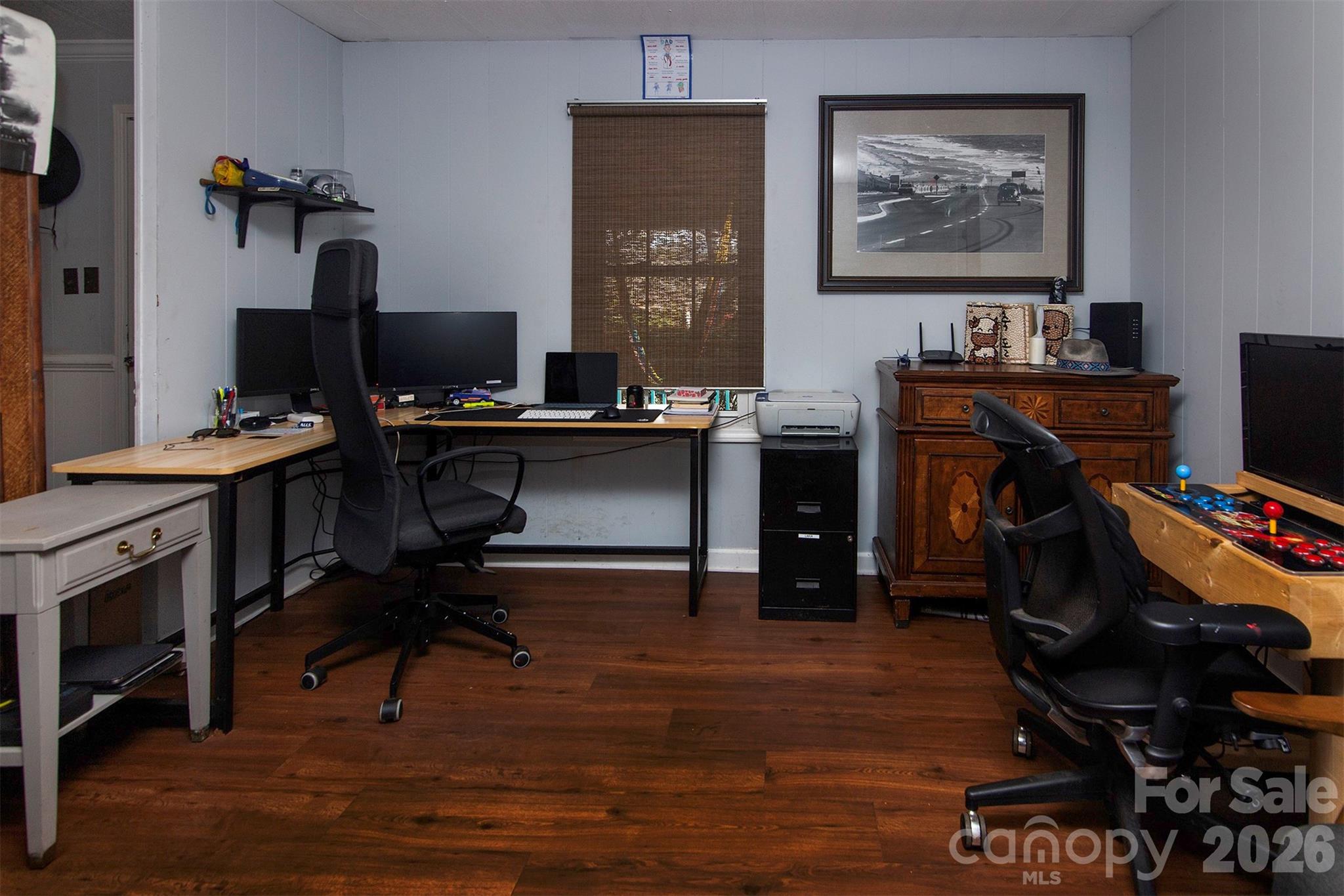 5727 Thompson Road Charlotte, NC 28216 - Photo 6 of 21 a view of a workspace with furniture and wooden floor