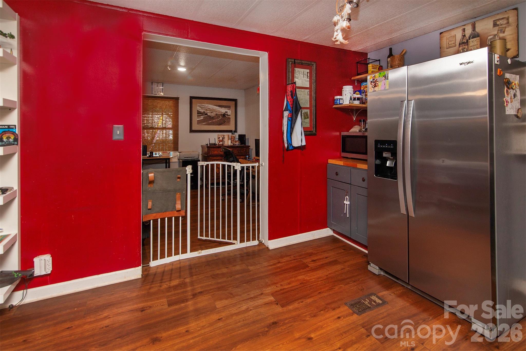 5727 Thompson Road Charlotte, NC 28216 - Photo 10 of 21 a view of a room with wooden floor