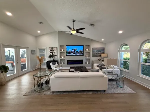 a living room with furniture and a flat screen tv