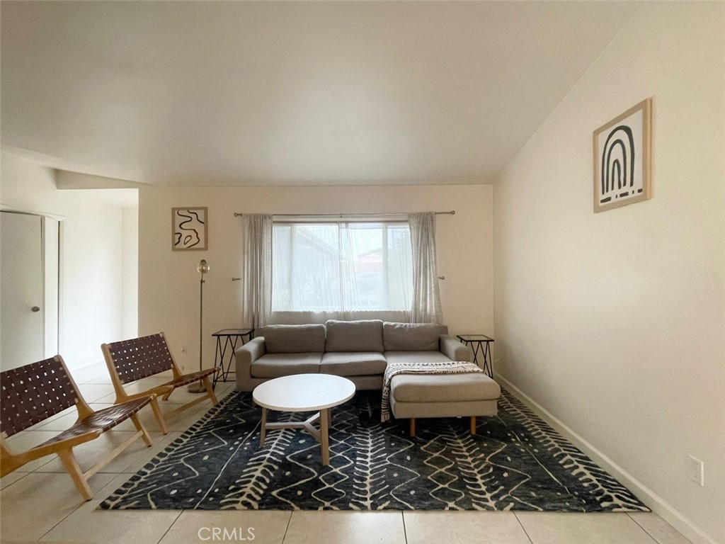 921 Regal Road Encinitas, CA 92024 - Photo 22 of 23 a living room with furniture and a window