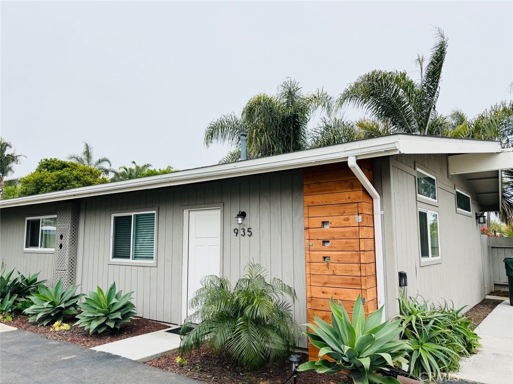 921 Regal Road Encinitas, CA 92024 - Photo 8 of 23 a front view of a house with garden