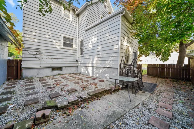 a view of a backyard with chairs