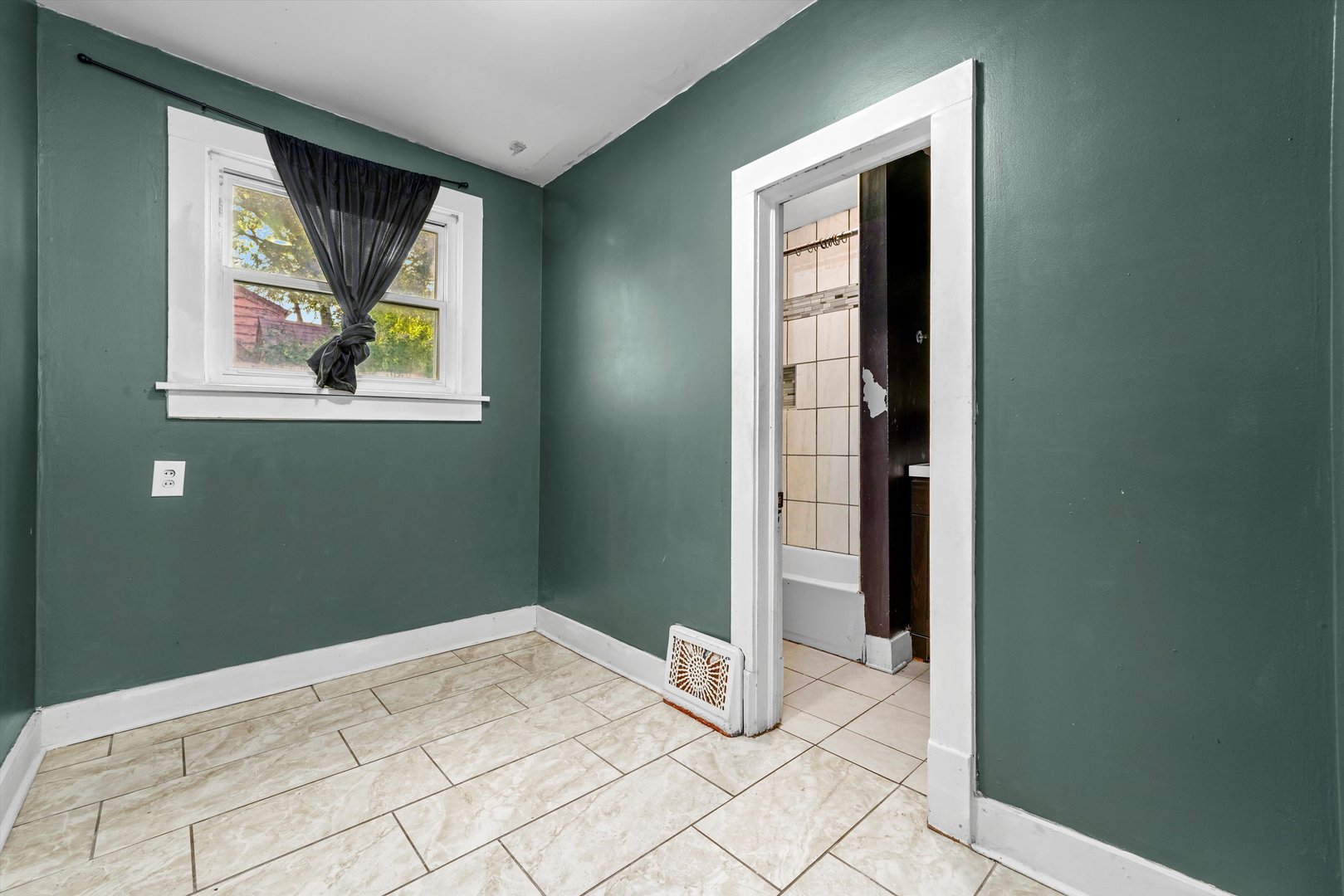 353 Wilcox Avenue Elgin, IL 60123 - Photo 5 of 19 a view of an empty room with window and bathroom