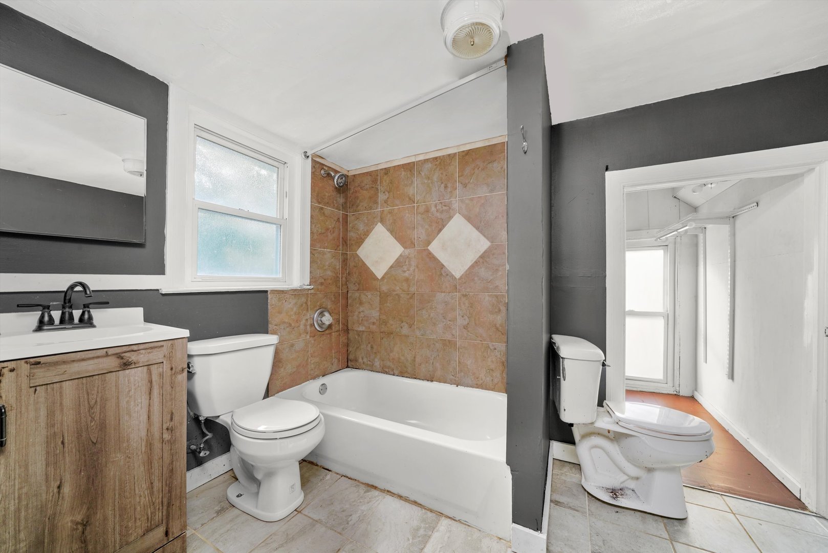 353 Wilcox Avenue Elgin, IL 60123 - Photo 10 of 19 a bathroom with a sink toilet and shower