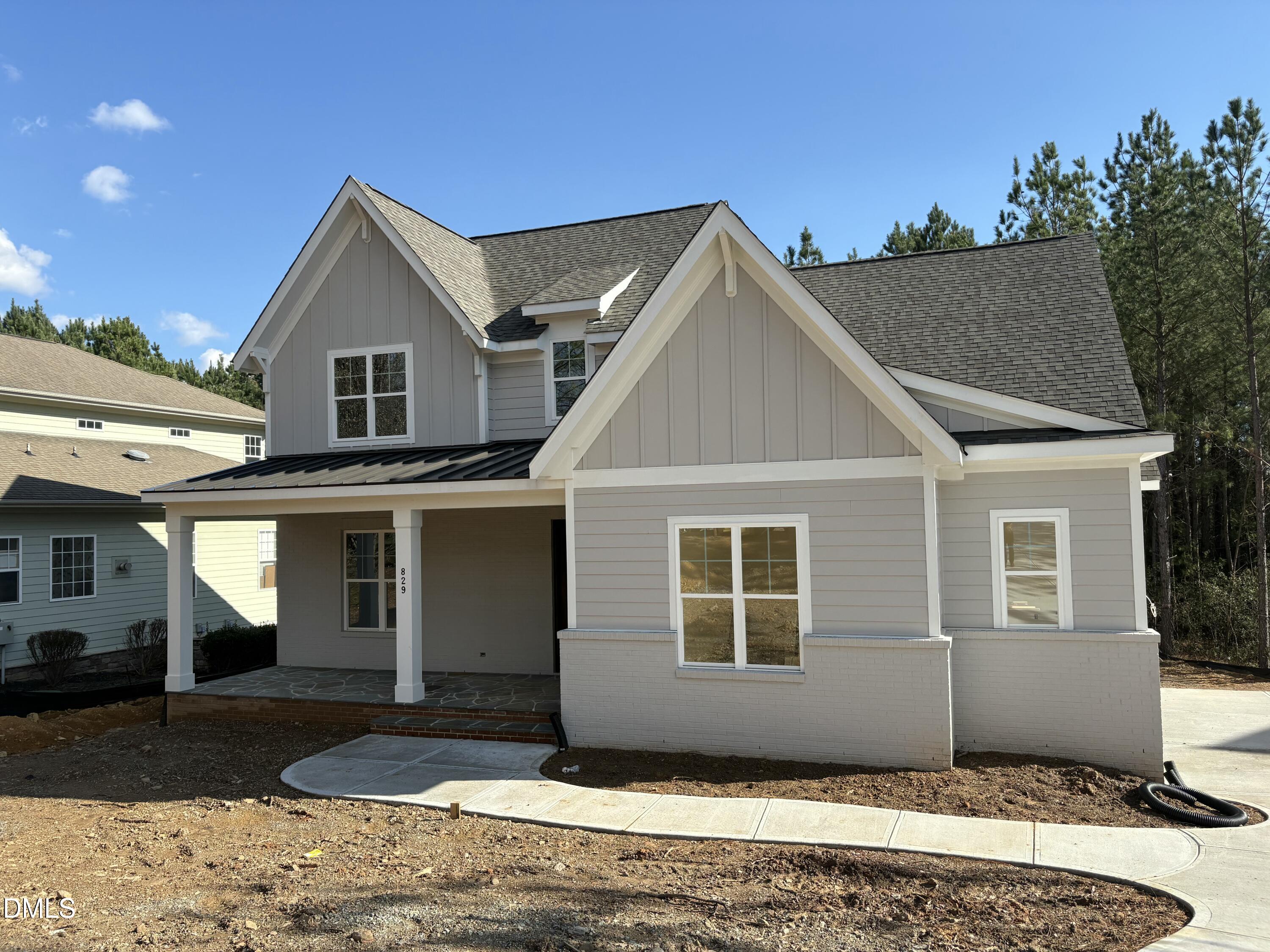 829 Chapel Ridge Drive Pittsboro, NC 27312 - Photo 2 of 23 a front view of a house with a yard