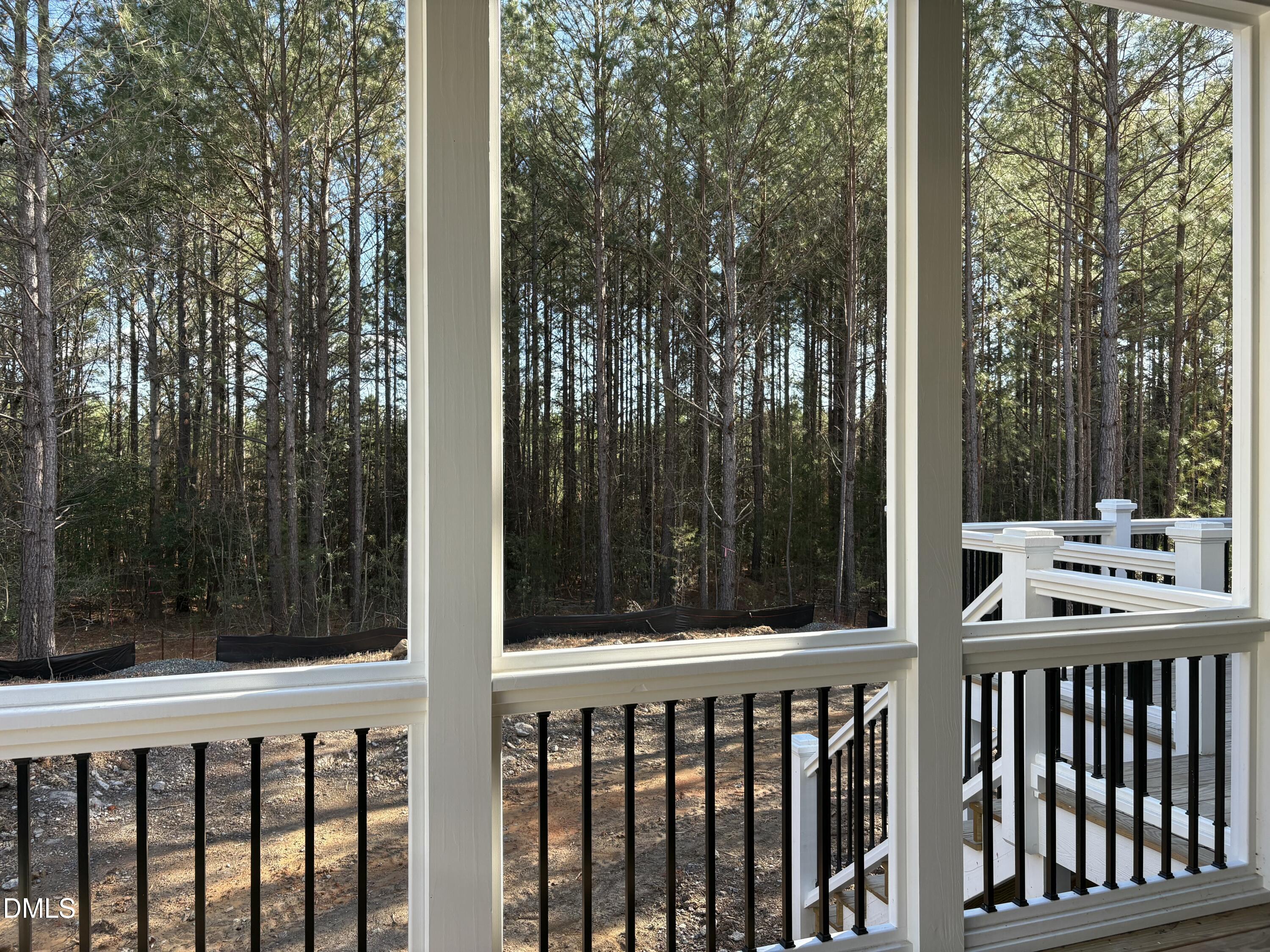 829 Chapel Ridge Drive Pittsboro, NC 27312 - Photo 5 of 23 a view of a wooden balcony and yard