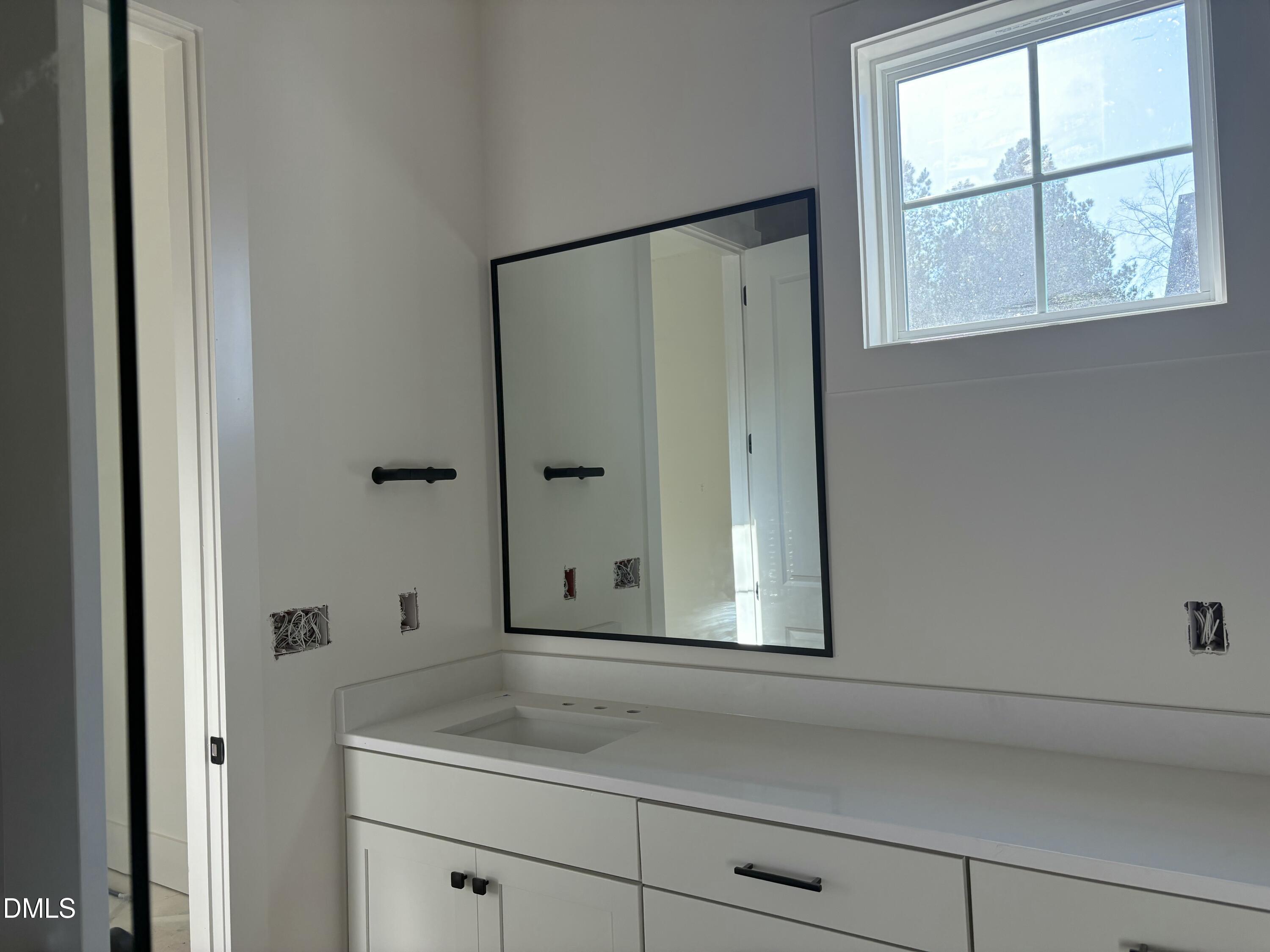 829 Chapel Ridge Drive Pittsboro, NC 27312 - Photo 7 of 23 a bathroom with a shower and a sink mirror