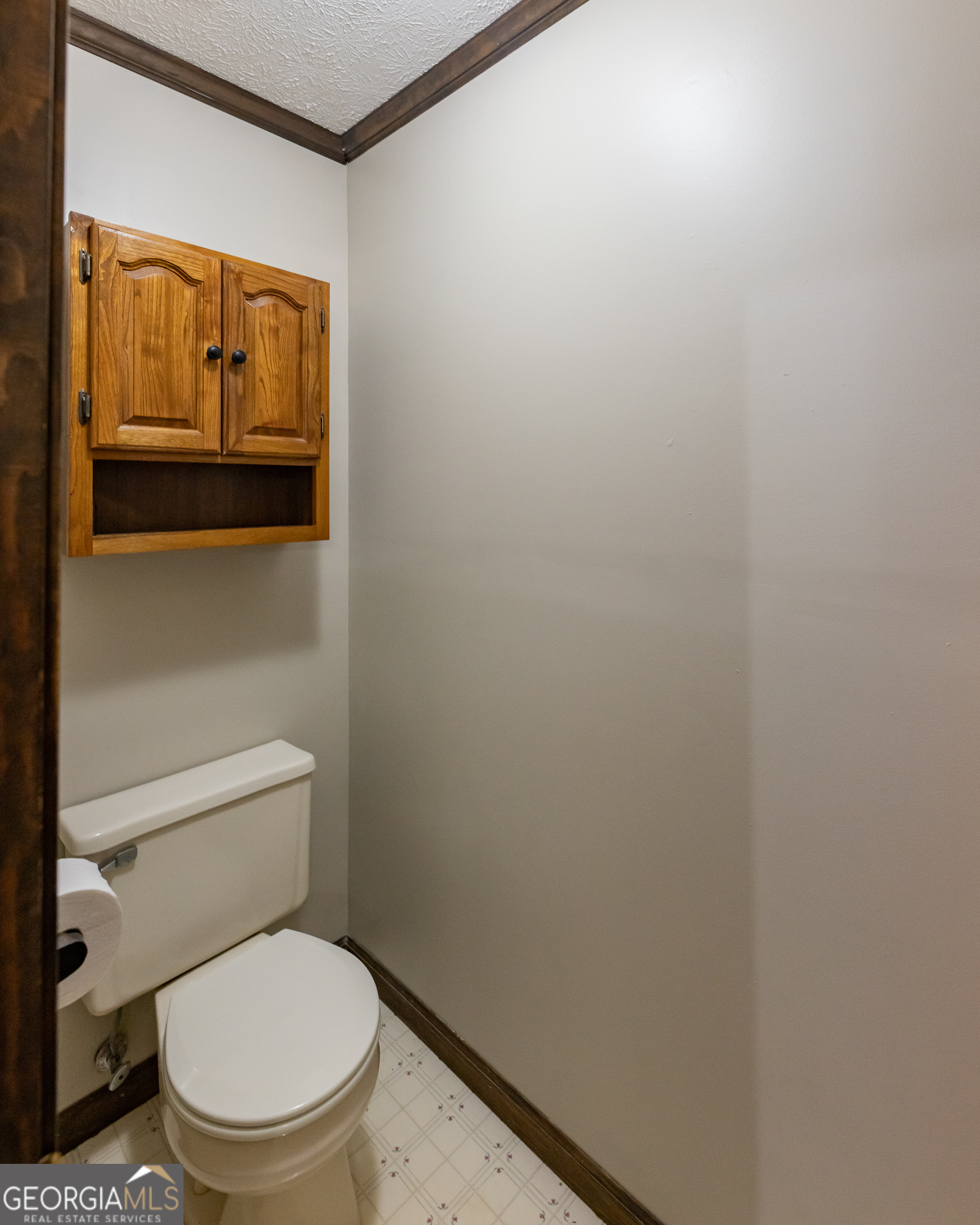 976 Windsweep Farm Road Thomaston, GA 30286 - Photo 18 of 98 a white toilet sitting next to a shower curtain