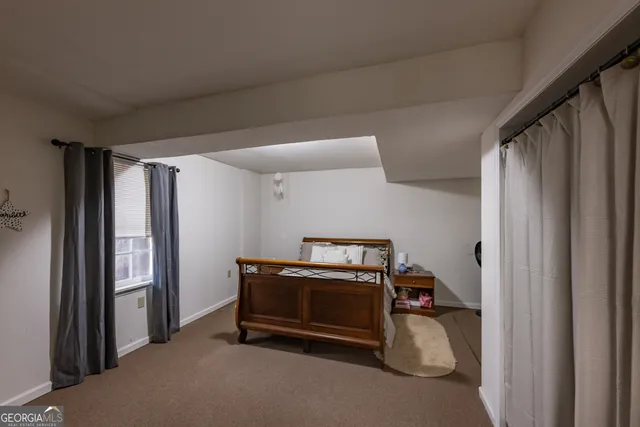 a view of a swimming pool with a patio and a yard