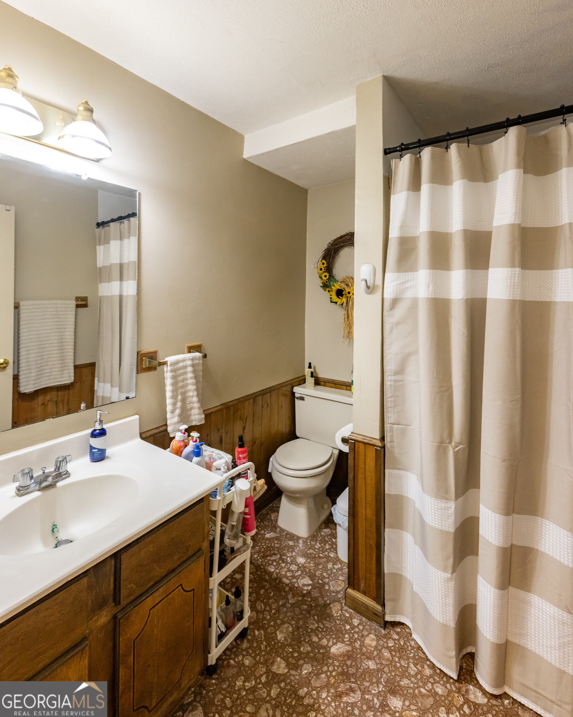 976 Windsweep Farm Road Thomaston, GA 30286 - Photo 35 of 98 a bathroom with a sink toilet and shower