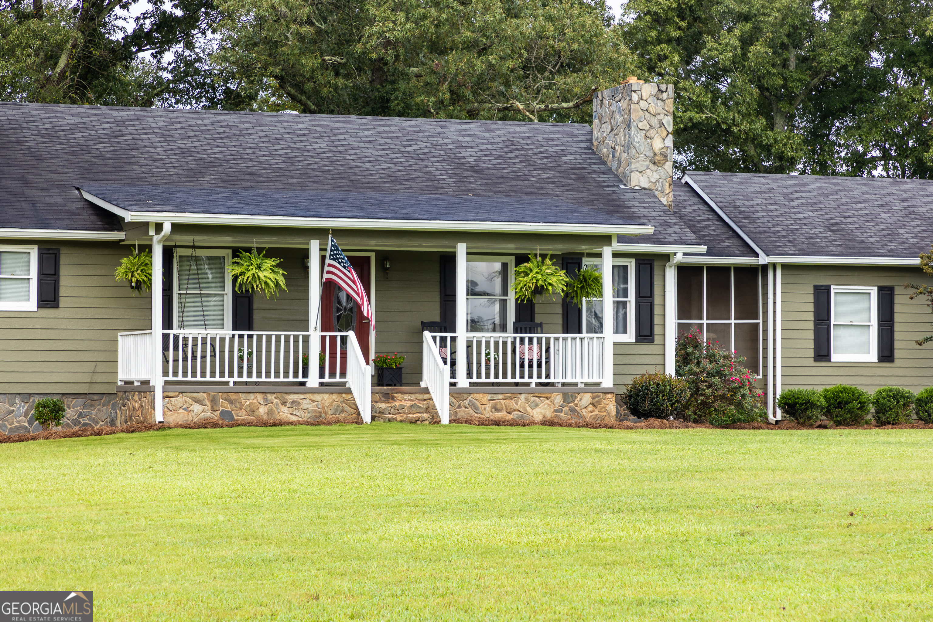 976 Windsweep Farm Road Thomaston, GA 30286 - Photo 40 of 98 a front view of a house with garden
