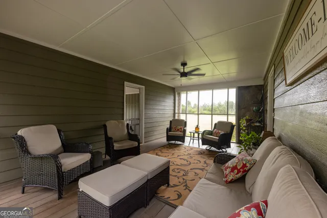 a living room with fireplace furniture and a flat screen tv
