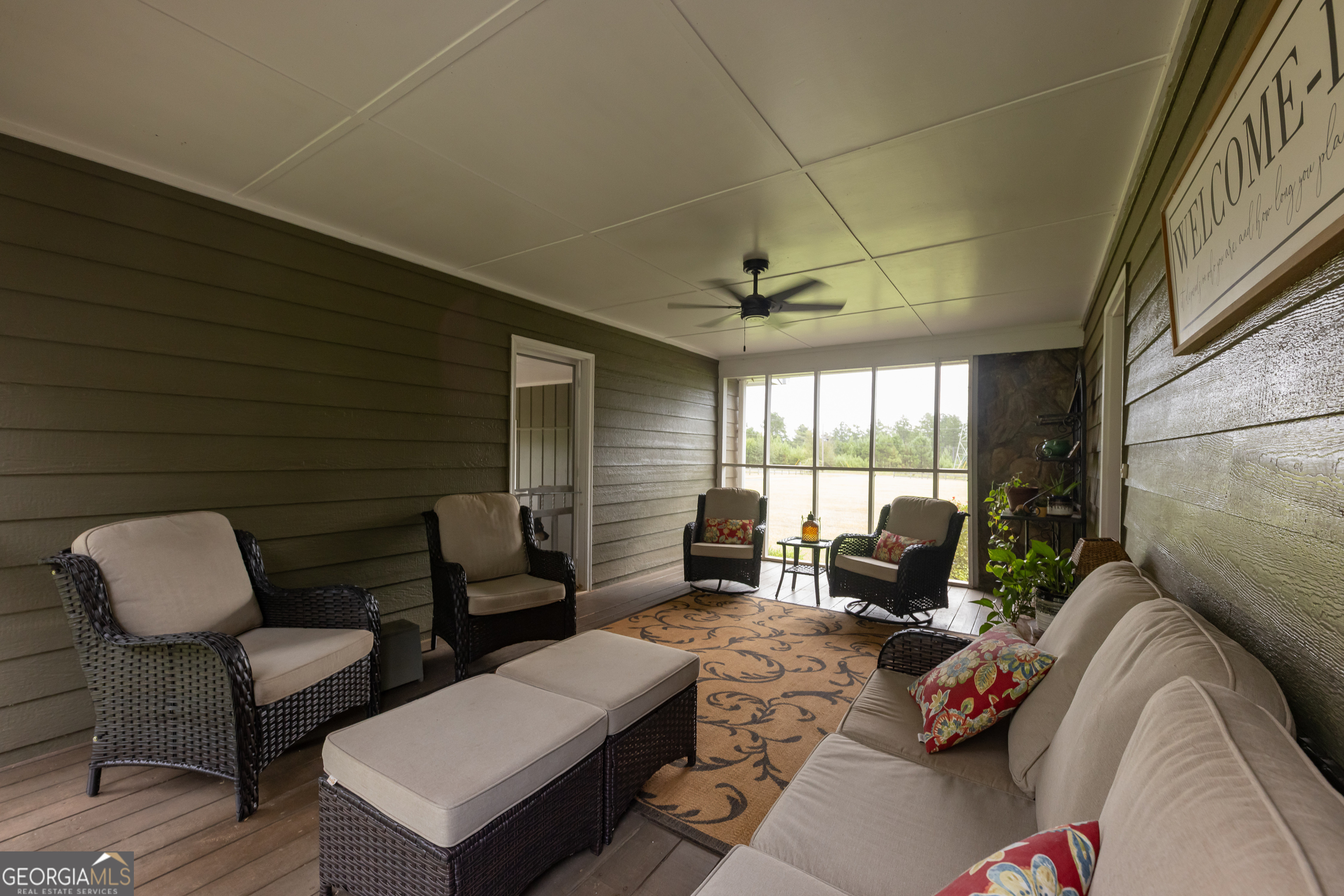 976 Windsweep Farm Road Thomaston, GA 30286 - Photo 5 of 98 a living room with furniture and a large window