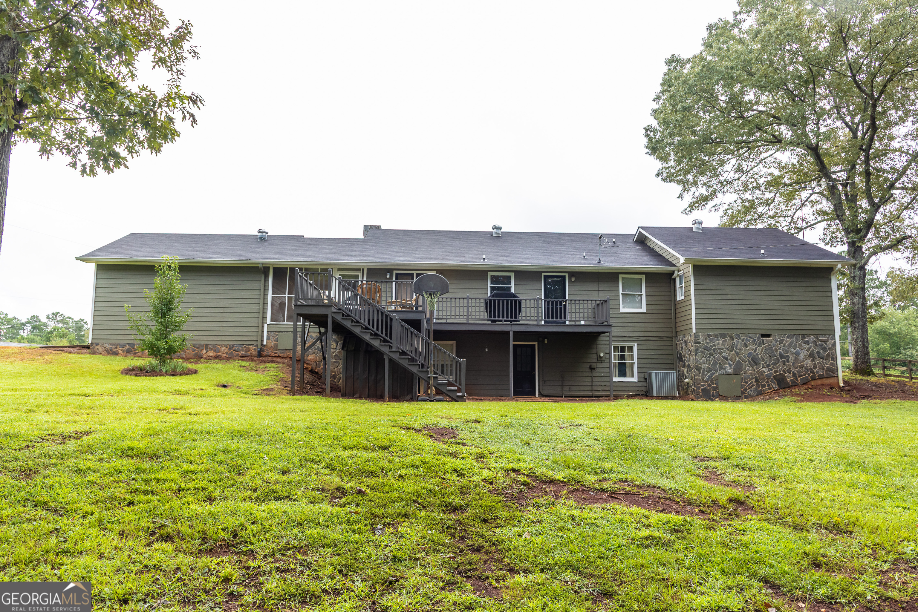 976 Windsweep Farm Road Thomaston, GA 30286 - Photo 55 of 98 a view of a house with a yard and sitting area