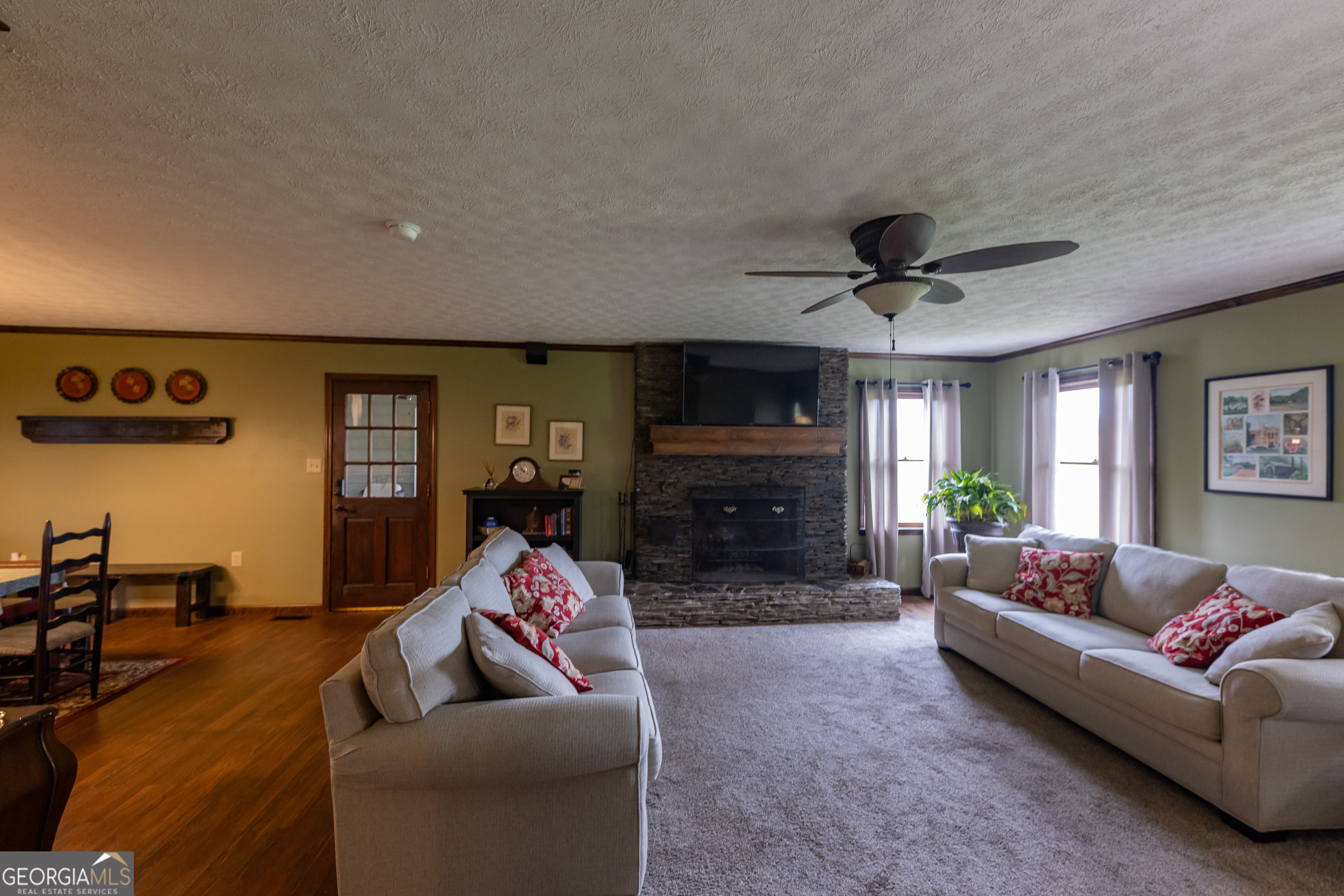 976 Windsweep Farm Road Thomaston, GA 30286 - Photo 8 of 98 a living room with furniture and a fireplace