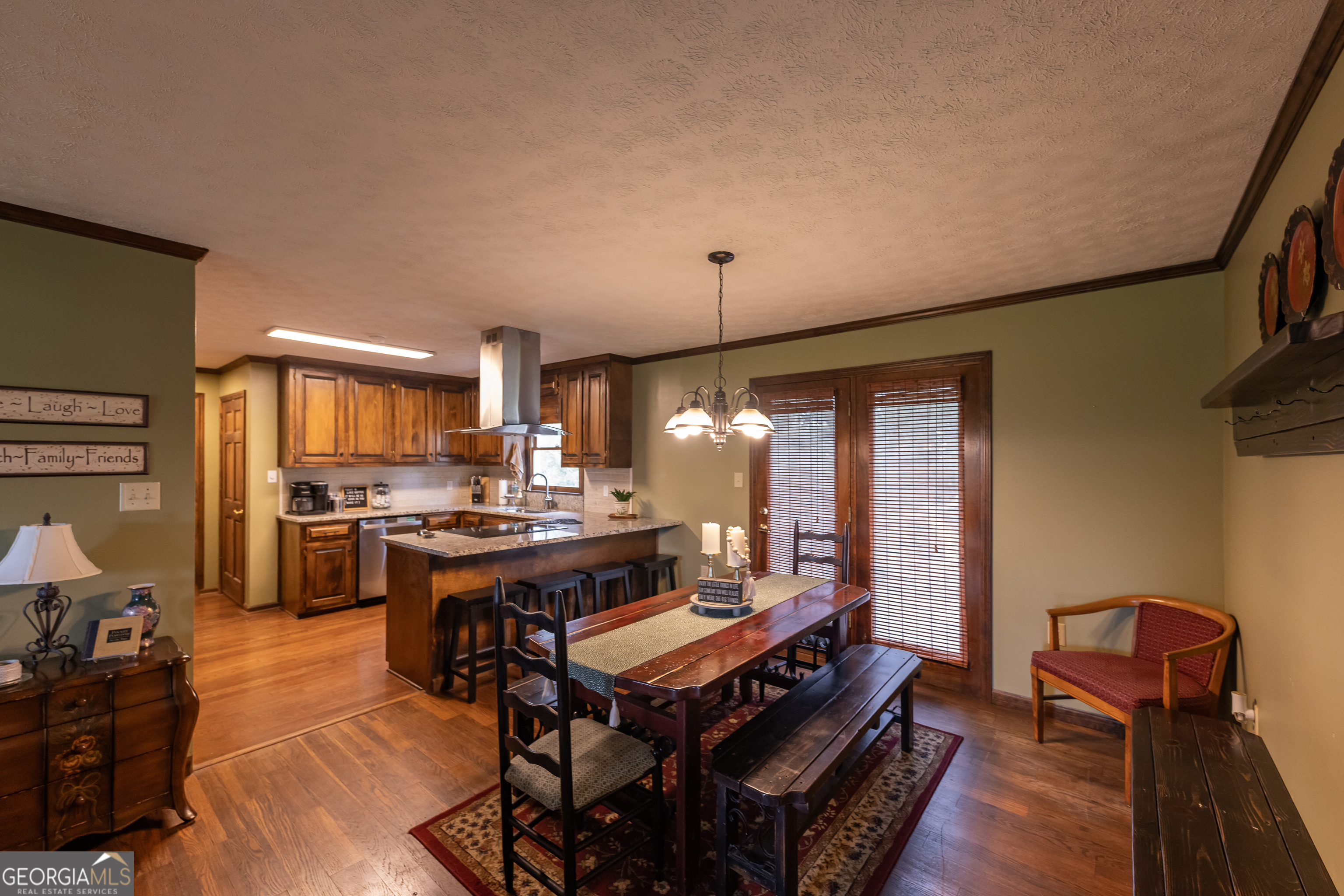 976 Windsweep Farm Road Thomaston, GA 30286 - Photo 9 of 98 a view of a dining room with furniture and wooden floor