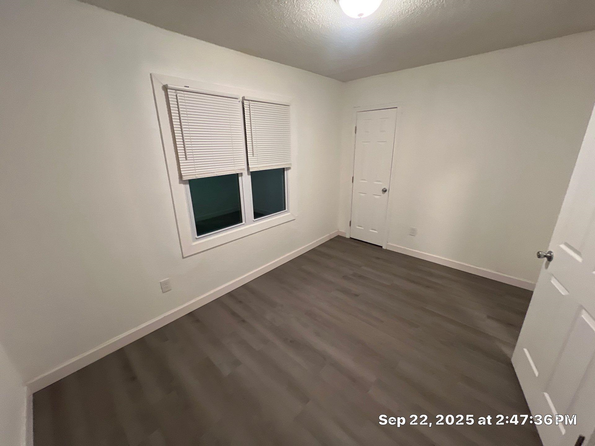 2773 Waverly Avenue Memphis, TN 38114 - Photo 19 of 20 a view of an empty room with wooden floor and a window