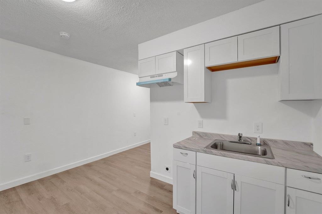 2773 Waverly Avenue Memphis, TN 38114 - Photo 2 of 20 a kitchen with cabinets and a sink