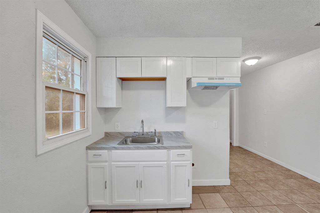2773 Waverly Avenue Memphis, TN 38114 - Photo 7 of 20 a kitchen with cabinets appliances and a sink
