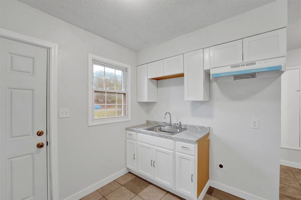 2773 Waverly Avenue Memphis, TN 38114 - Photo 8 of 20 a bathroom with a sink vanity granite and a mirror
