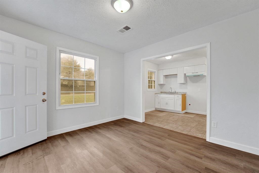 2773 Waverly Avenue Memphis, TN 38114 - Photo 9 of 20 a view of a kitchen with wooden floor and windows