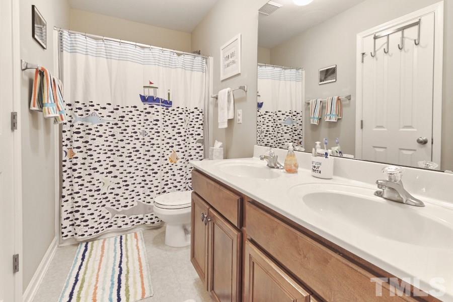 8518 Eden Park Drive Raleigh, NC 27613 - Photo 22 of 25 Upstairs, shared bath