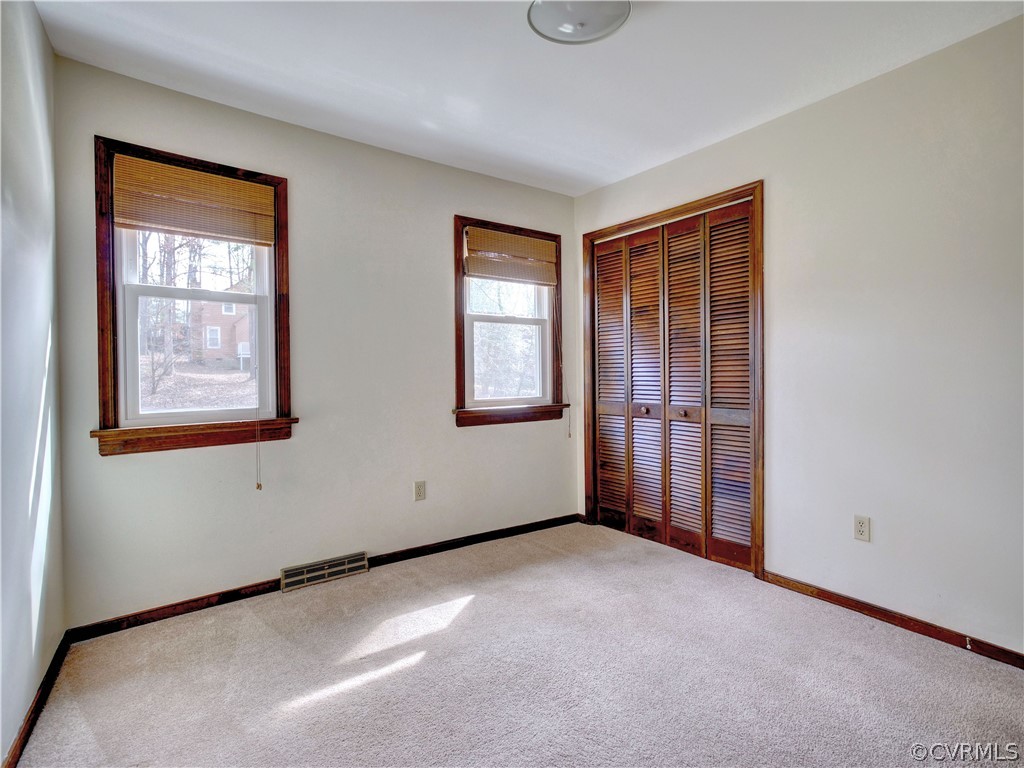 7400 Drexelbrook Road Chesterfield, VA 23832 - Photo 14 of 32 an empty room with windows