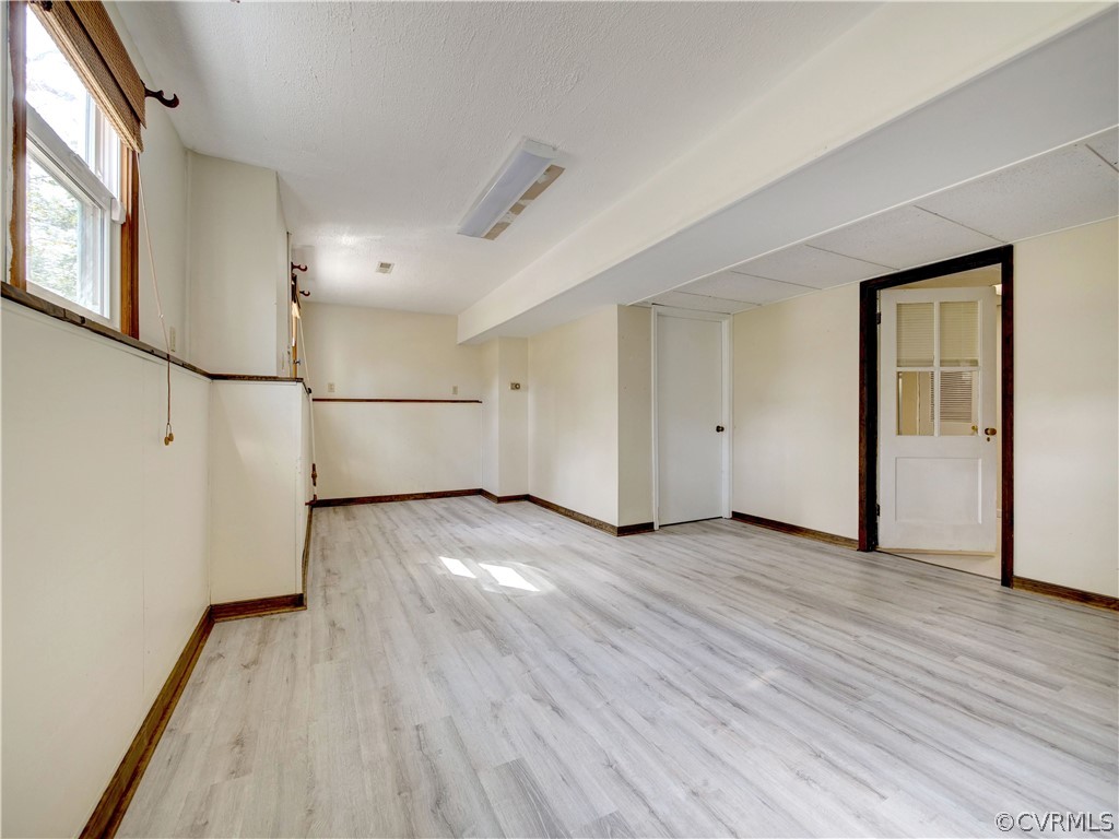 7400 Drexelbrook Road Chesterfield, VA 23832 - Photo 23 of 32 a view of empty room with wooden floor and refrigerator