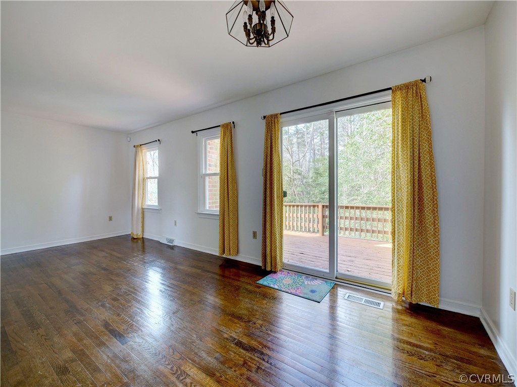 7400 Drexelbrook Road Chesterfield, VA 23832 - Photo 6 of 32 a view of an empty room with wooden floor and a window
