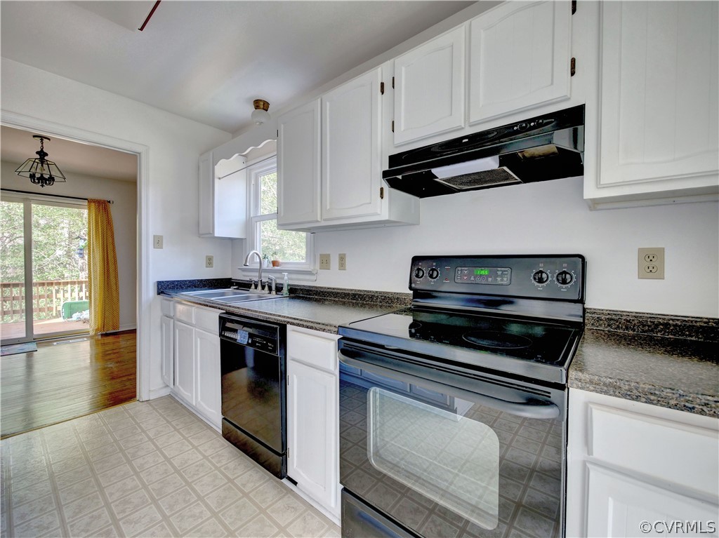 7400 Drexelbrook Road Chesterfield, VA 23832 - Photo 9 of 32 a kitchen with cabinets appliances and a window