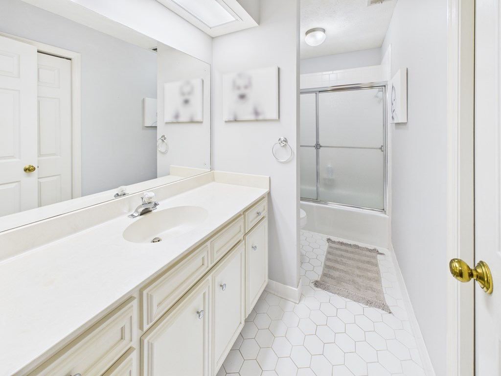 6390 Cape Cod Drive Columbus, GA 31904 - Photo 18 of 22 a spacious bathroom with a tub sink and mirror