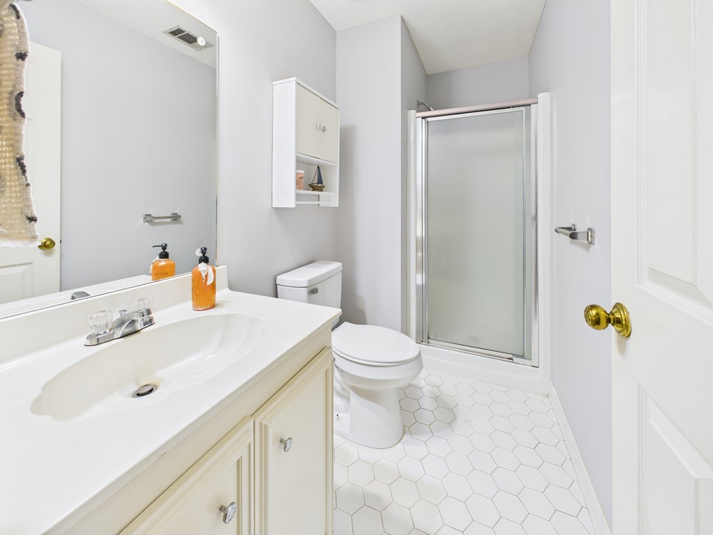 6390 Cape Cod Drive Columbus, GA 31904 - Photo 22 of 22 a bathroom with a sink toilet and shower