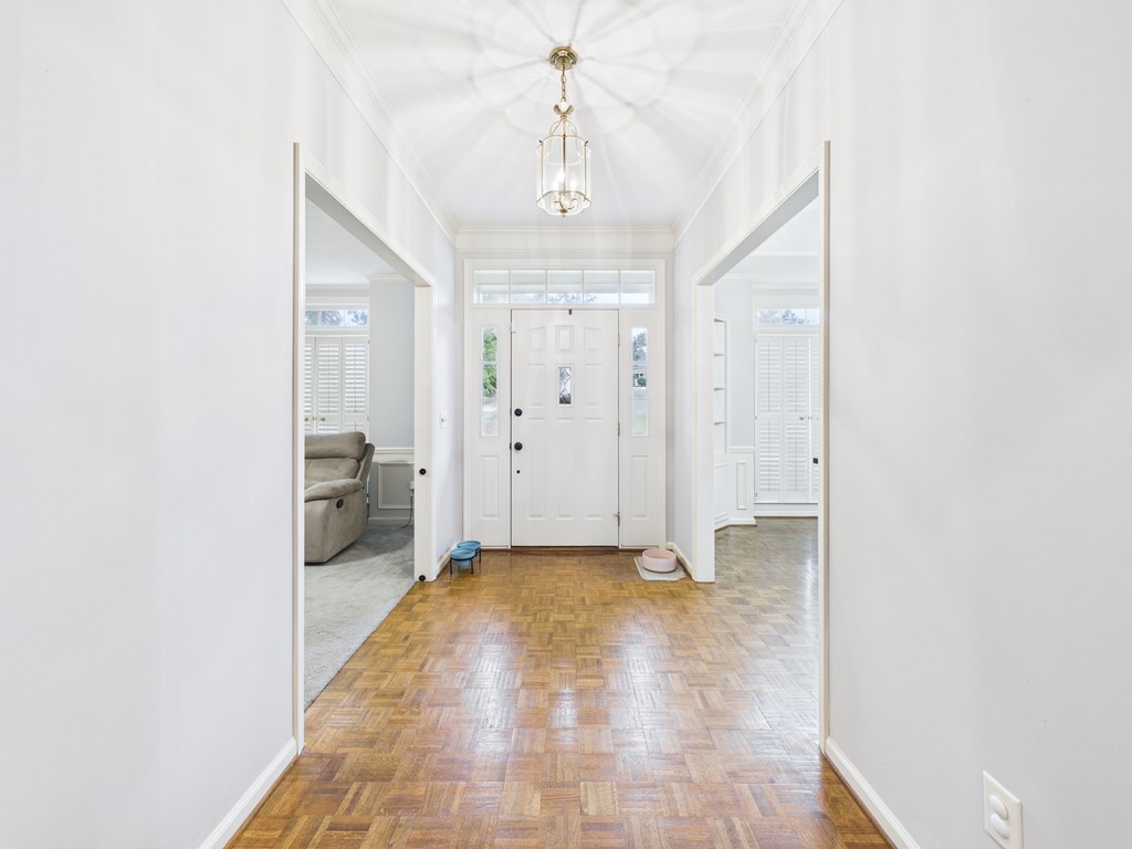 6390 Cape Cod Drive Columbus, GA 31904 - Photo 3 of 22 a view of a hallway with a chandelier