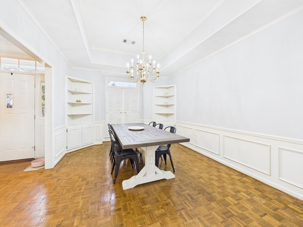 6390 Cape Cod Drive Columbus, GA 31904 - Photo 6 of 22 a view of a dining room with furniture and a chandelier