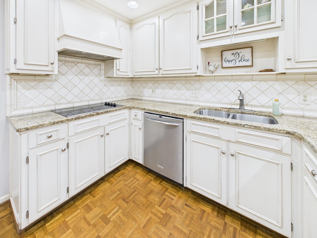 6390 Cape Cod Drive Columbus, GA 31904 - Photo 9 of 22 a kitchen with granite countertop white cabinets and sink