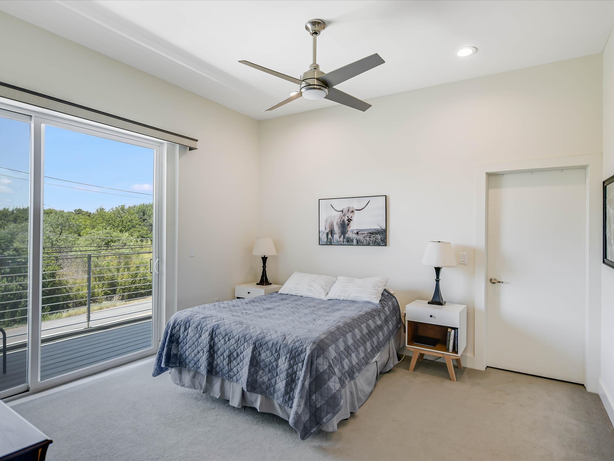 604 North Bluff Drive, Unit 101 Austin, TX 78745 - Photo 15 of 22 Bedroom with multiple windows, access to exterior, light carpet, a ceiling fan, and recessed lighting