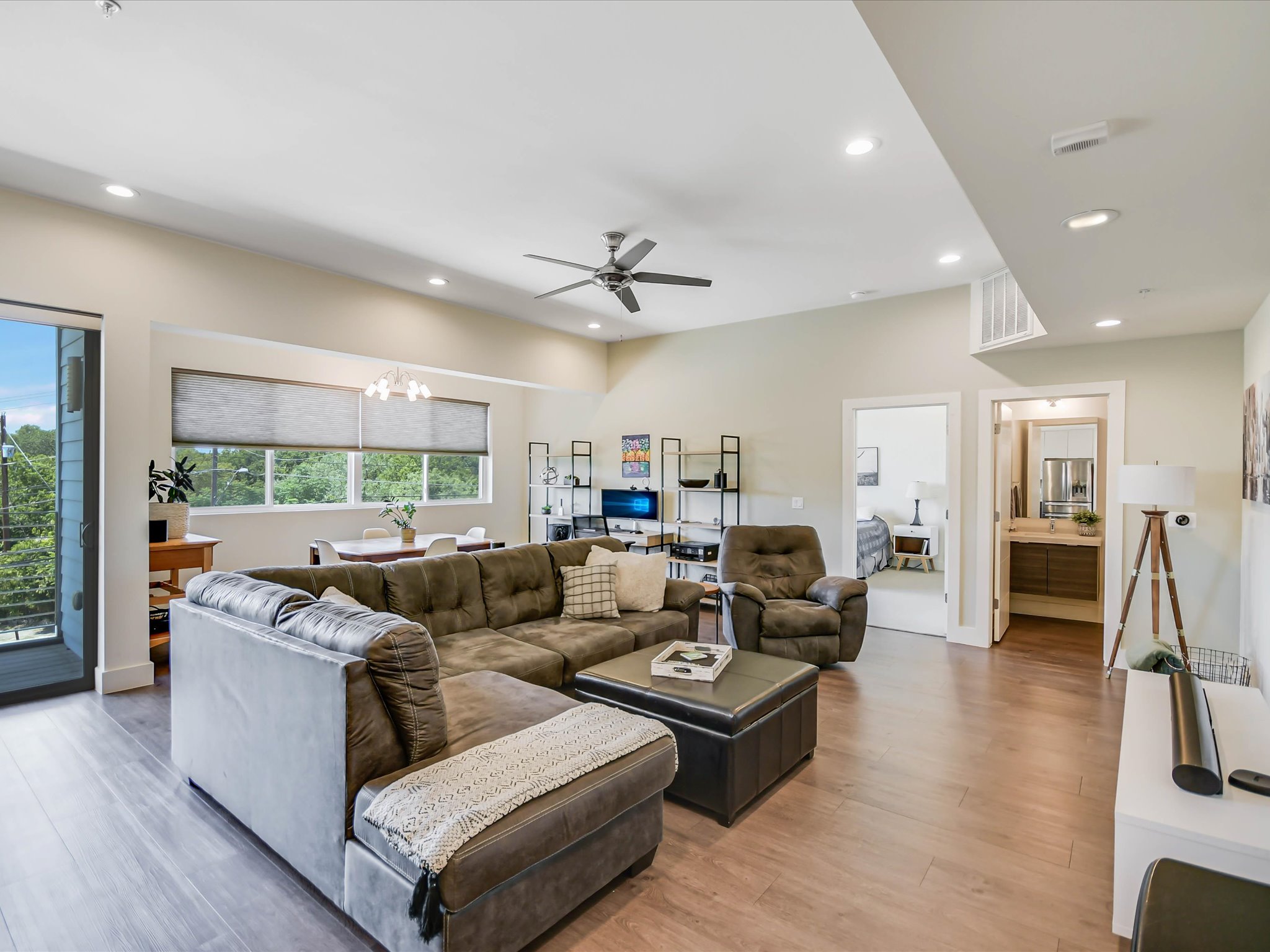 604 North Bluff Drive, Unit 101 Austin, TX 78745 - Photo 6 of 22 Living area featuring a chandelier, recessed lighting, light wood-type flooring, and a ceiling fan