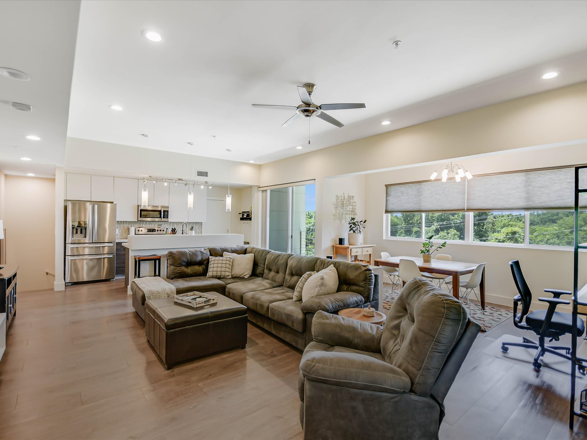 604 North Bluff Drive, Unit 101 Austin, TX 78745 - Photo 8 of 22 Living room featuring a ceiling fan, light wood-type flooring, recessed lighting, and a chandelier