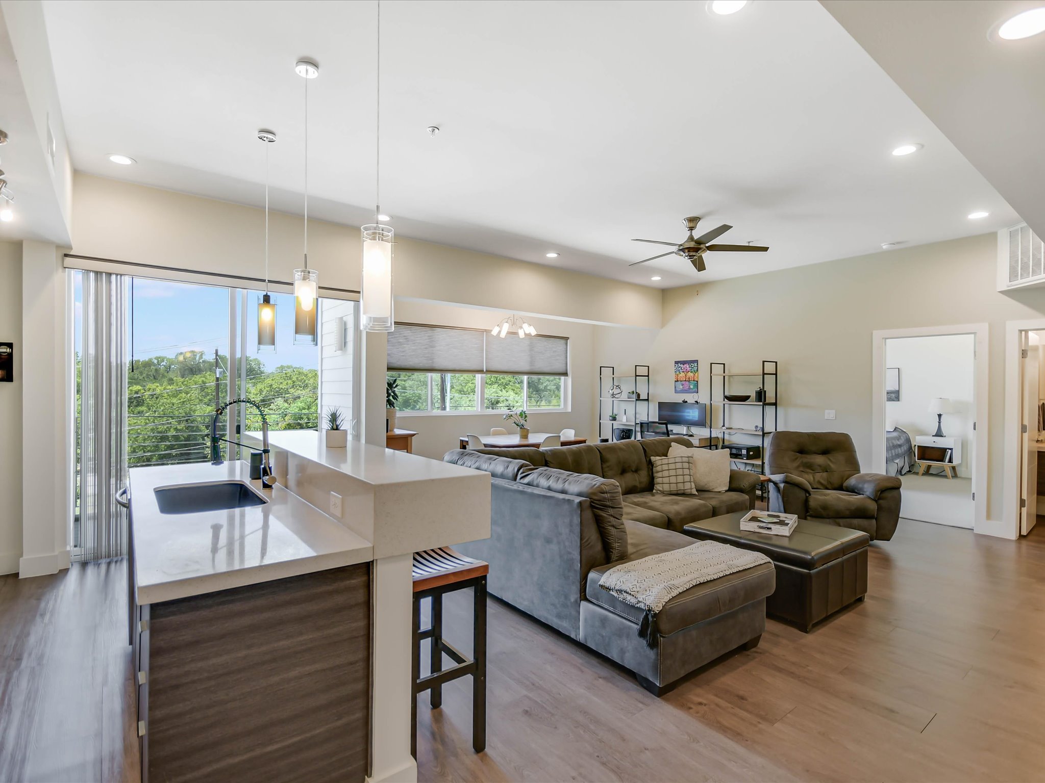 604 North Bluff Drive, Unit 101 Austin, TX 78745 - Photo 10 of 22 Living room with wood finished floors, recessed lighting, ceiling fan, and a chandelier