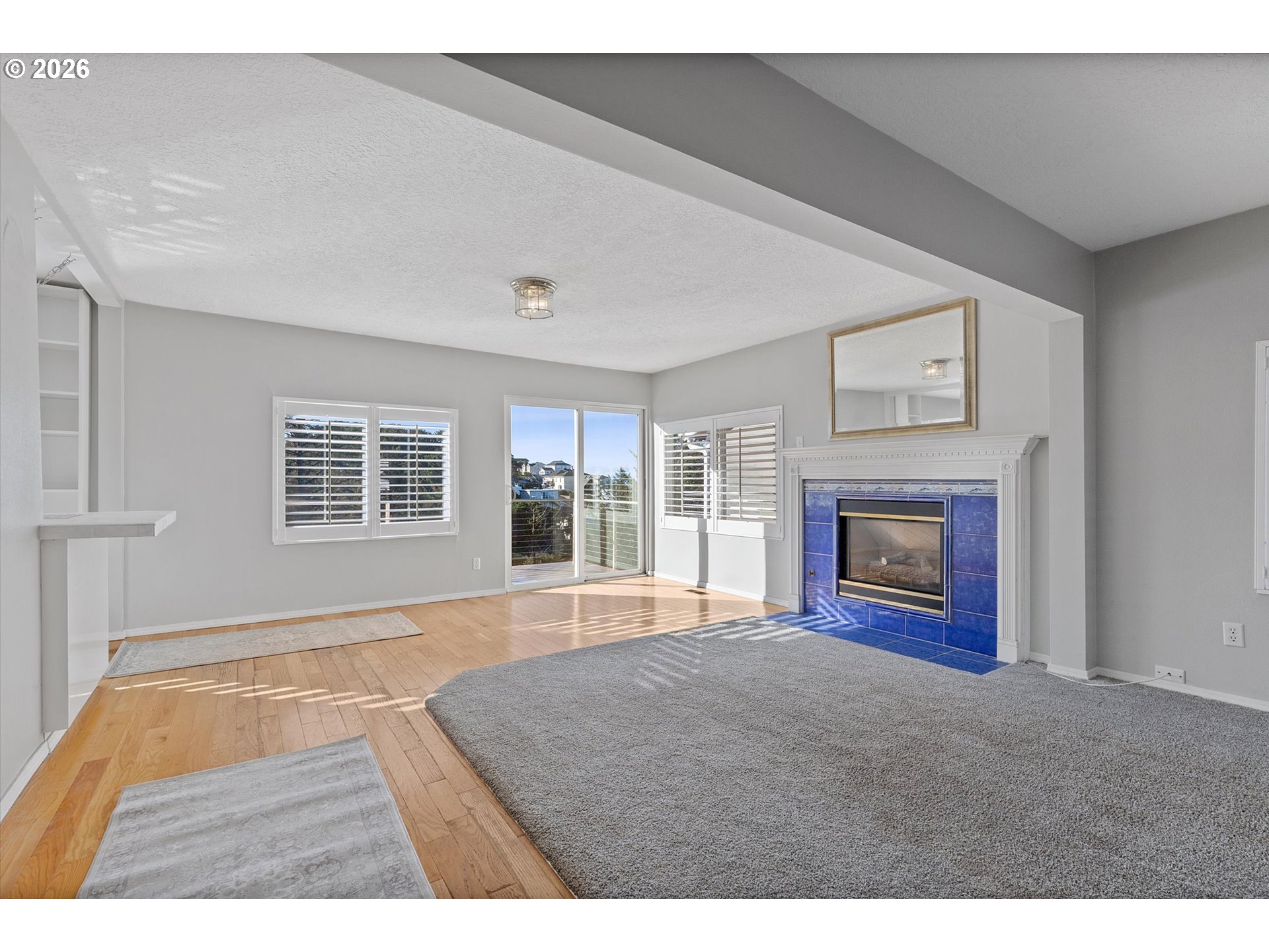 860 Southwest 10th Street Lincoln City, OR 97367 - Photo 15 of 45 a view of empty room with a fireplace