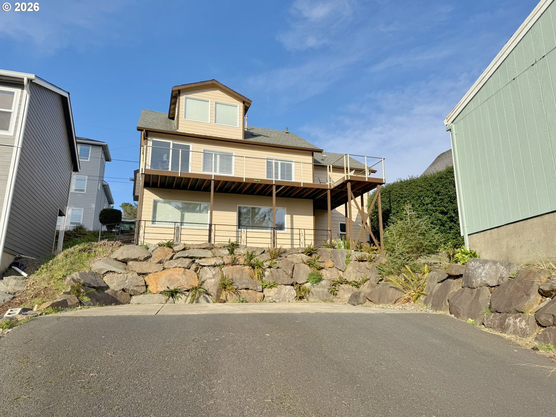 860 Southwest 10th Street Lincoln City, OR 97367 - Photo 5 of 11 a front view of a house with a yard