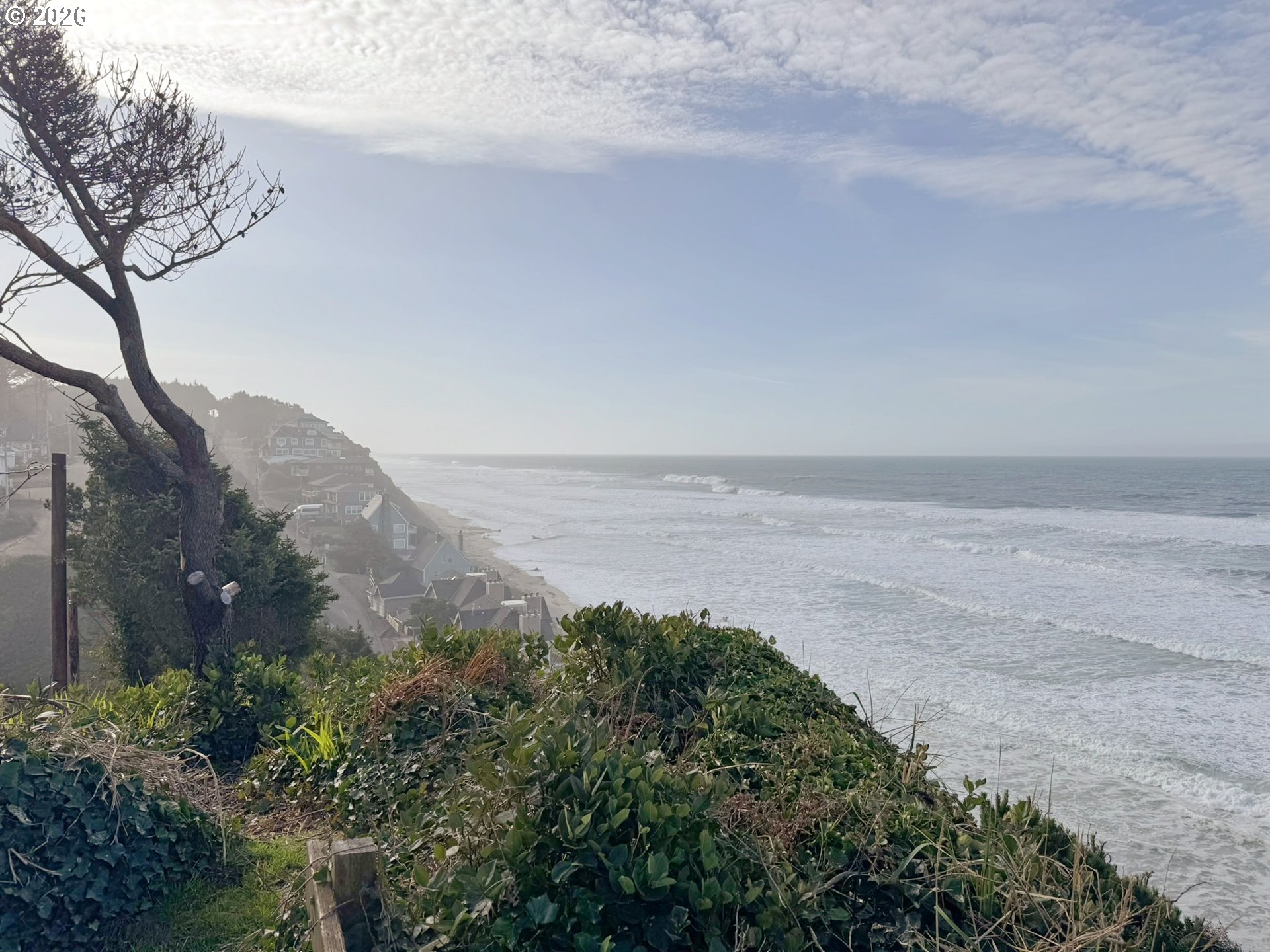 860 Southwest 10th Street Lincoln City, OR 97367 - Photo 8 of 11 a view of a lake with mountains in the background