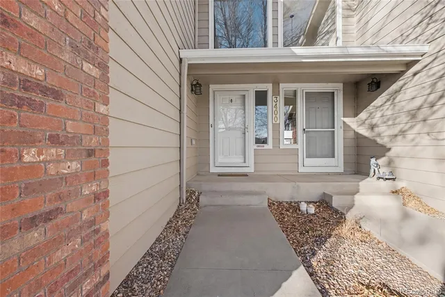 a front view of a house with a rug