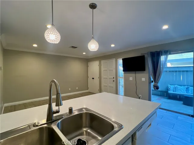a kitchen with a sink and a microwave
