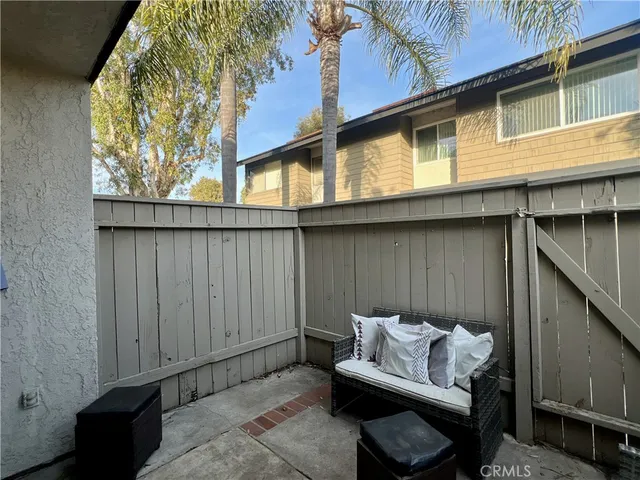 a view of a patio in the backyard